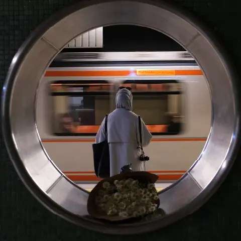 Person waiting to board a subway