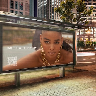 Ad for Michael Kors jewelry on a bus shelter