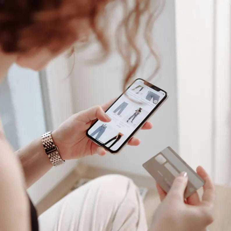 Person shopping on their mobile device.